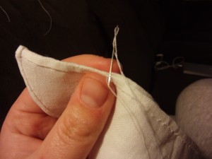 Put the top edge together, right side to right side, and whipstitch along the edge. You only want to go about halfway