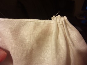Stitch a few times across the tops of the pleats to hold them in place