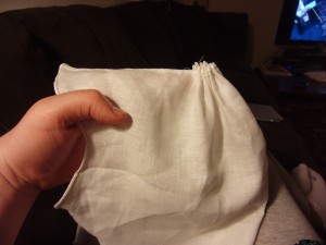 Take the remaining gap at the top, and pleat it very tightly together