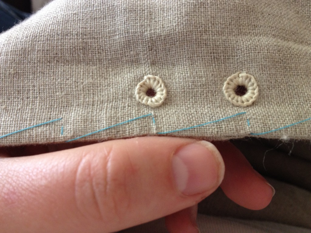 Eyelets from the front. The blue thread is simply a marker to tell me where to put in the next eyelet. Not as painful as pins, not as difficult as chalk or pen.